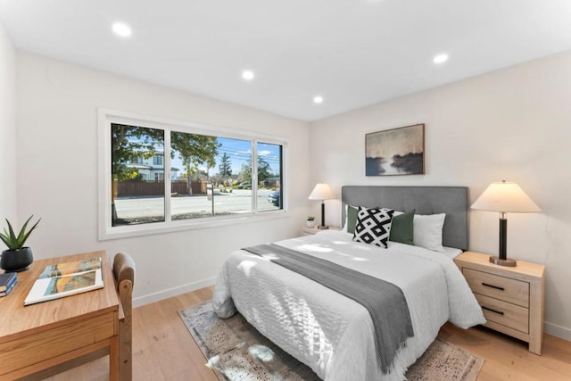 bedroom with light hardwood / wood-style floors