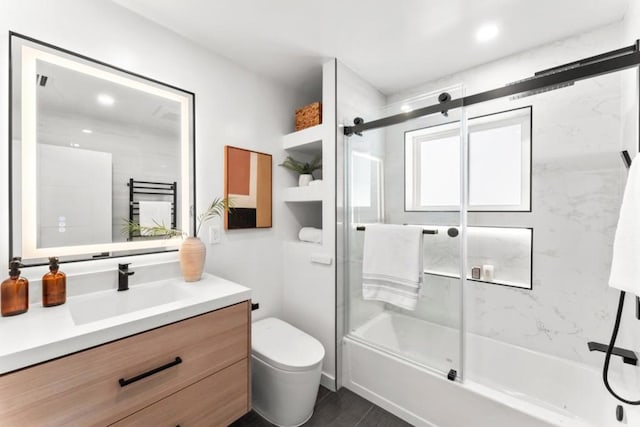 full bathroom with vanity, toilet, and enclosed tub / shower combo