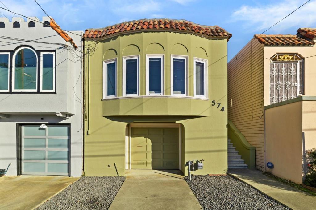 mediterranean / spanish house featuring a garage