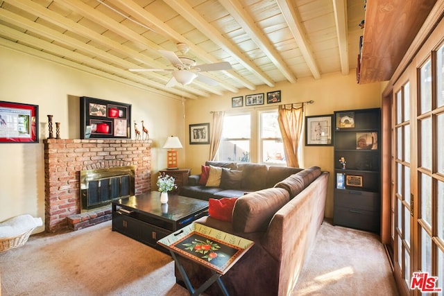 carpeted living room featuring beam ceiling, a fireplace, wooden ceiling, and ceiling fan