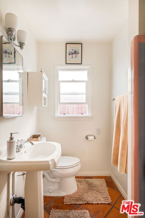 bathroom featuring tile patterned floors and toilet