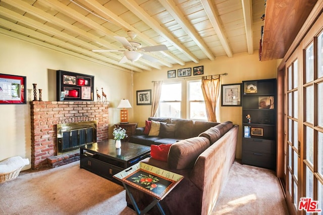 living room with light colored carpet, a fireplace, beam ceiling, and wood ceiling