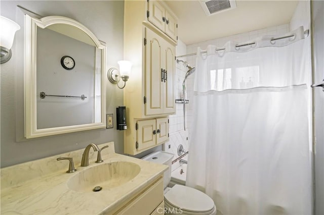 full bathroom with vanity, toilet, and shower / bath combo