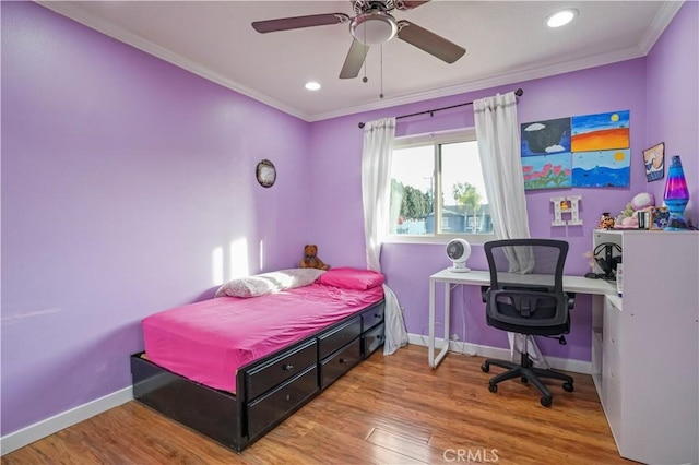 bedroom featuring crown molding, hardwood / wood-style flooring, and ceiling fan