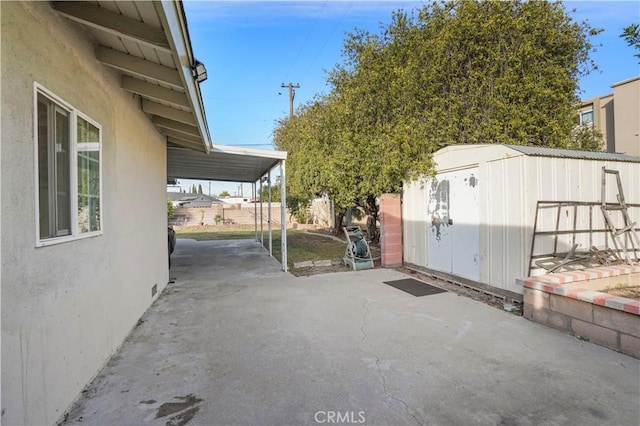 view of patio / terrace with a shed