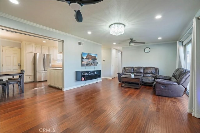 living room featuring ceiling fan, dark wood-type flooring, and ornamental molding