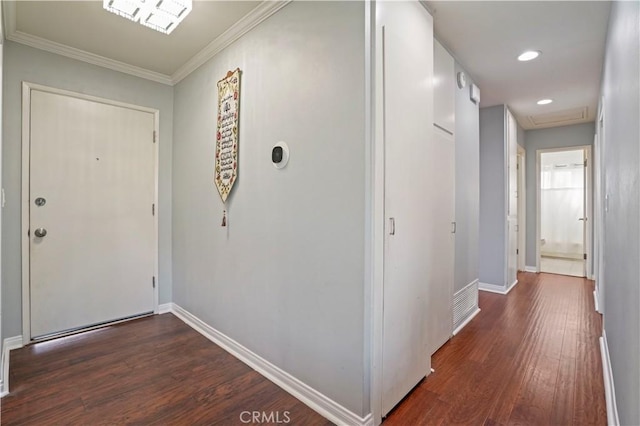 hallway featuring dark hardwood / wood-style floors and ornamental molding