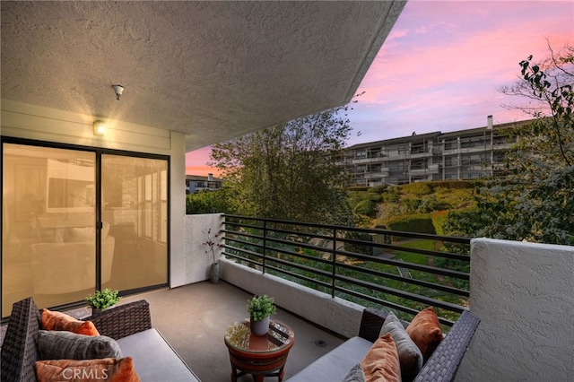 view of balcony at dusk