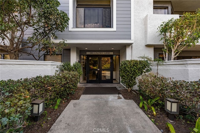 view of exterior entry featuring french doors