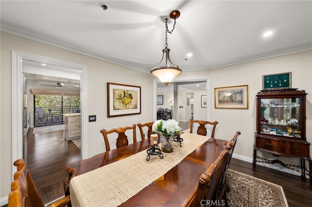 dining room featuring crown molding and dark hardwood / wood-style floors