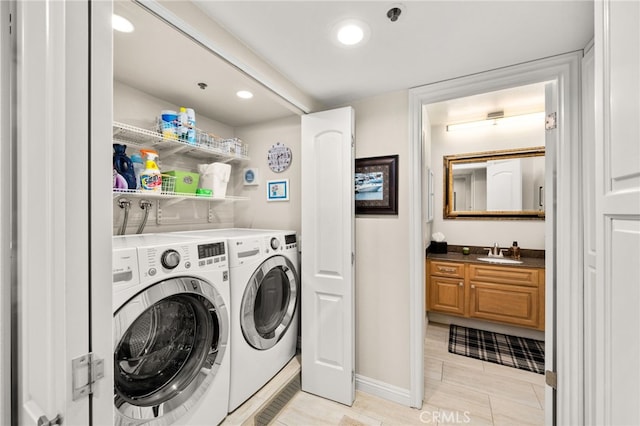 laundry room with sink and washing machine and dryer