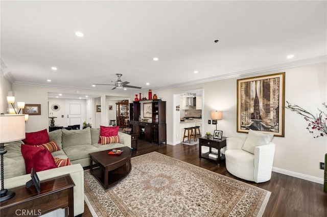 living room with dark wood-type flooring, ceiling fan, and ornamental molding