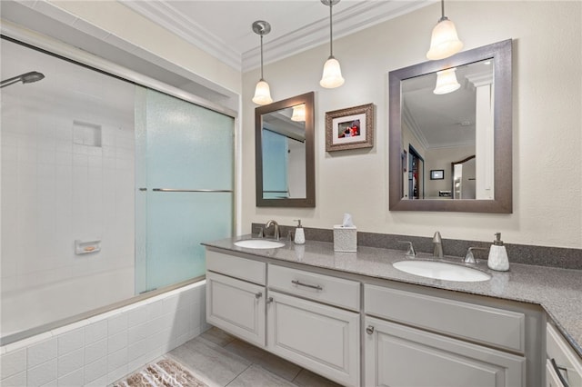 bathroom featuring tile patterned floors, shower / bath combination with glass door, vanity, and ornamental molding