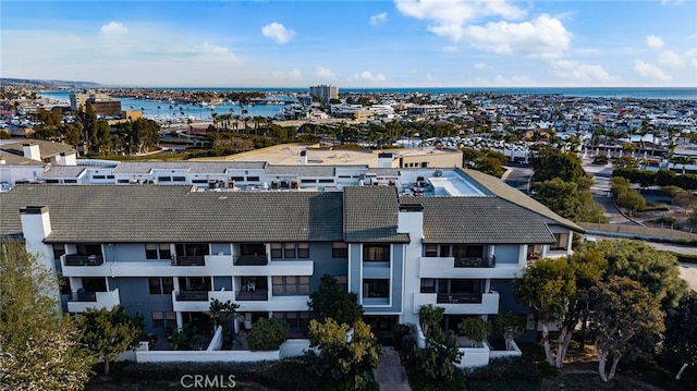 birds eye view of property with a water view