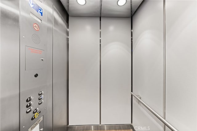 interior details featuring elevator and a mail area