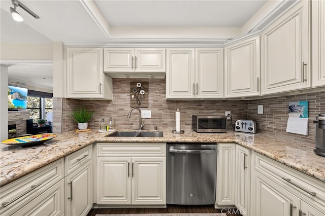 kitchen with sink, dishwasher, light stone counters, and tasteful backsplash