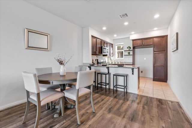 dining room featuring wood-type flooring