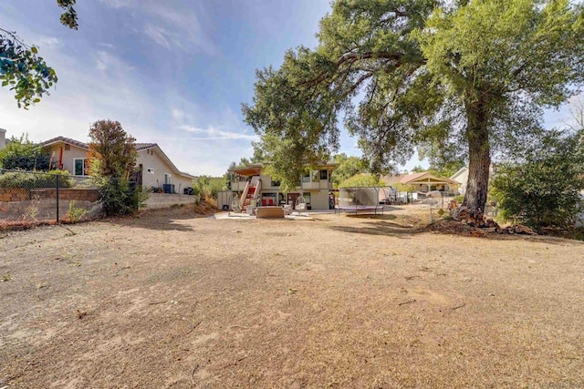 view of yard with a trampoline