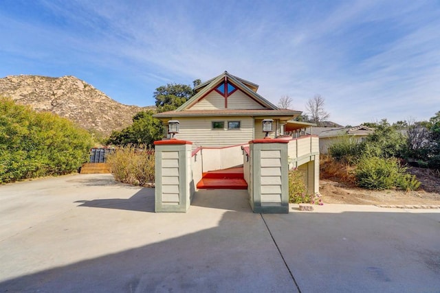 view of front of home featuring a mountain view and a patio