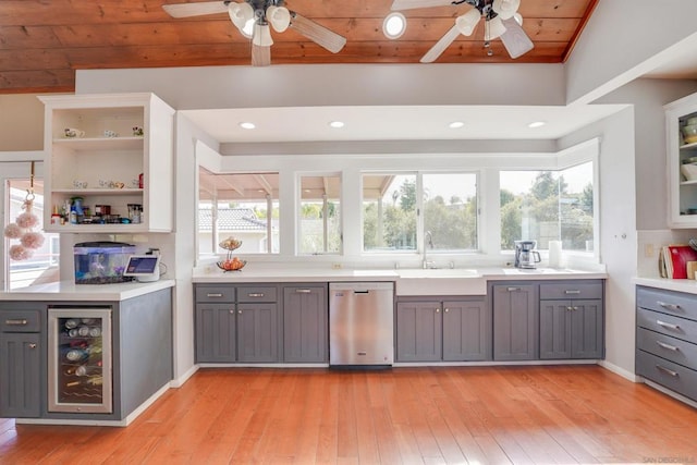 interior space featuring stainless steel dishwasher and gray cabinetry