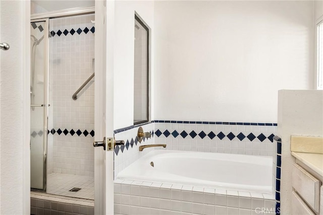 bathroom with vanity and independent shower and bath