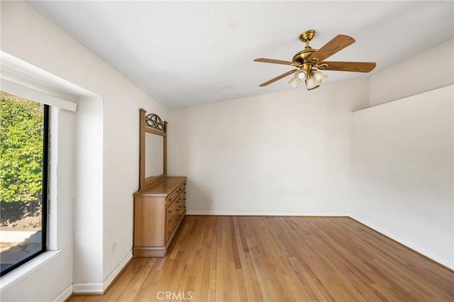 unfurnished room featuring ceiling fan and light wood-type flooring