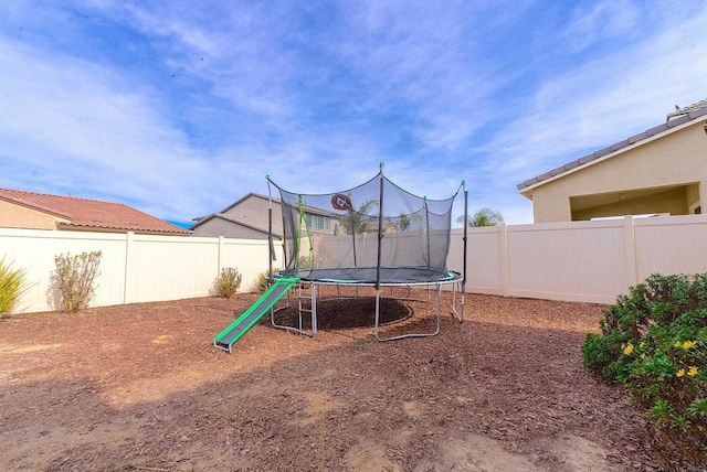 view of play area with a trampoline