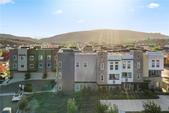 birds eye view of property featuring a mountain view