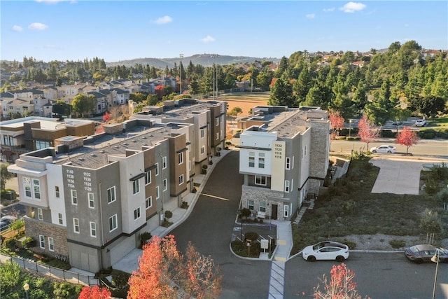 birds eye view of property with a mountain view