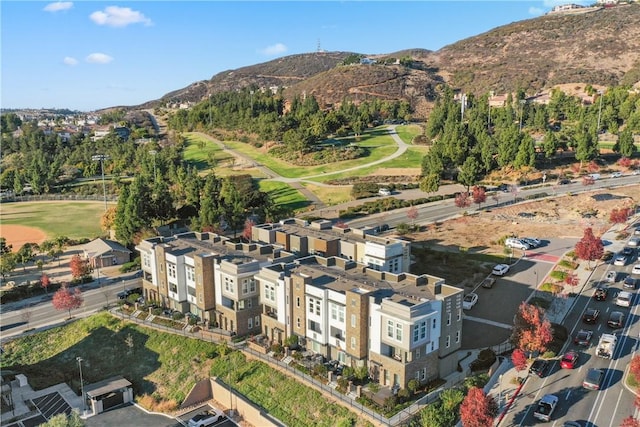 birds eye view of property with a mountain view