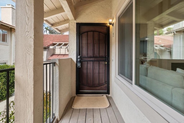 doorway to property with a balcony