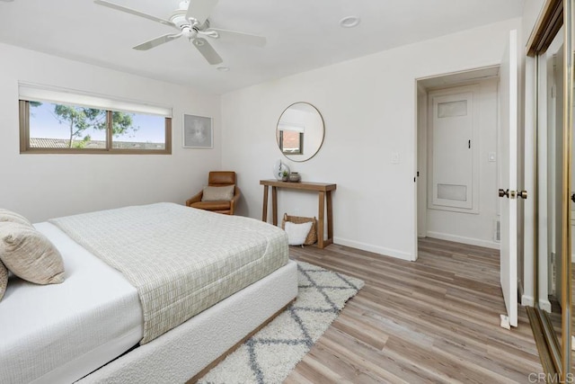 bedroom featuring light hardwood / wood-style floors and ceiling fan