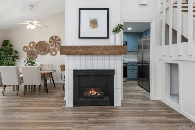 unfurnished living room featuring light hardwood / wood-style flooring and ceiling fan