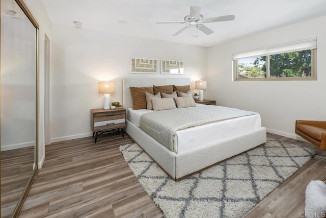 bedroom featuring a closet, ceiling fan, and hardwood / wood-style flooring