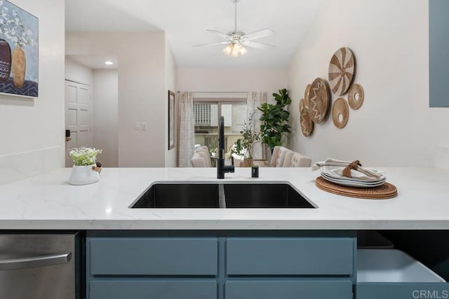 kitchen featuring sink, blue cabinetry, stainless steel dishwasher, and ceiling fan