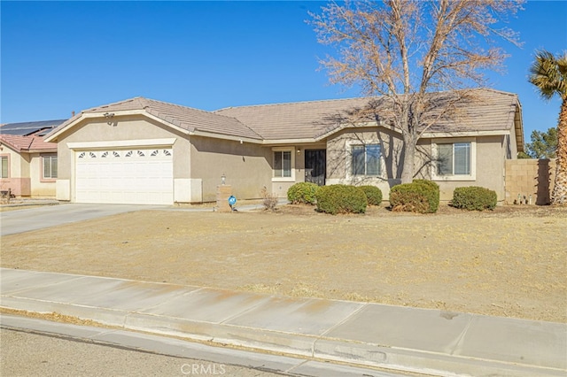 ranch-style home featuring a garage