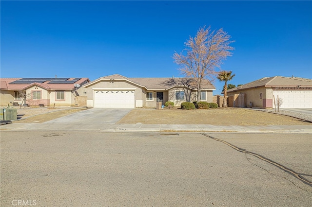 single story home featuring a garage and solar panels