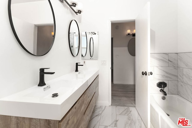 bathroom featuring vanity and bathing tub / shower combination