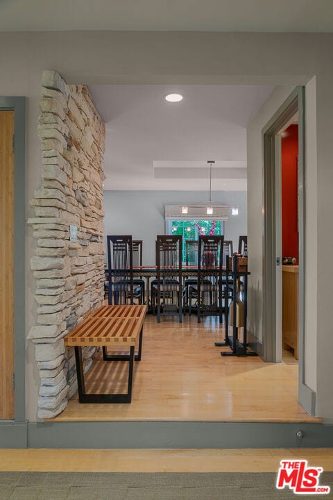 corridor with wood-type flooring