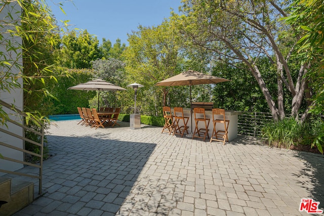 view of patio / terrace featuring a bar