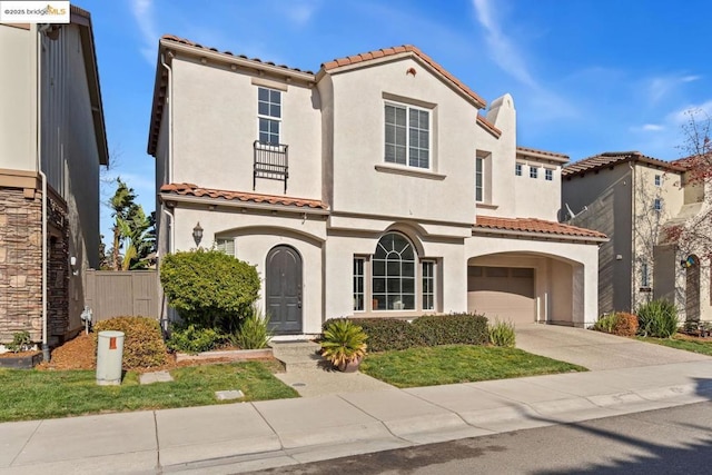 mediterranean / spanish-style house featuring a garage