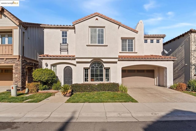 mediterranean / spanish-style home featuring a garage