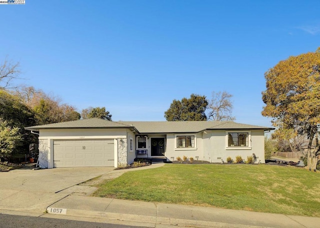 ranch-style home with a front yard and a garage