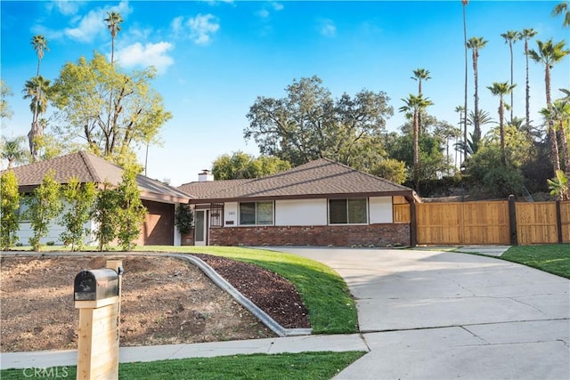 ranch-style house featuring a garage