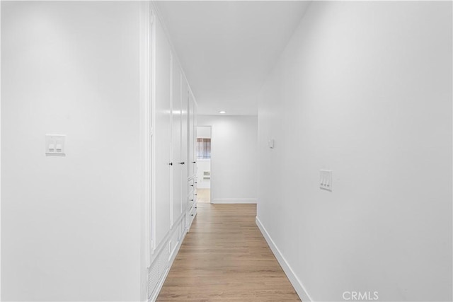 corridor featuring light hardwood / wood-style floors