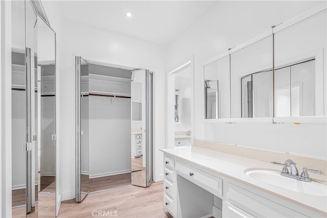 bathroom featuring vanity and hardwood / wood-style floors