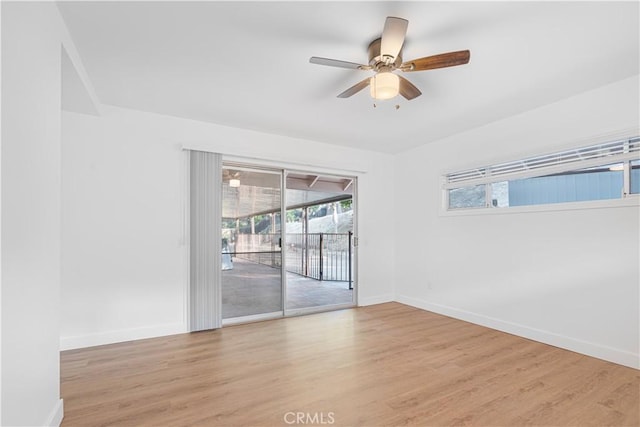 unfurnished room featuring ceiling fan and light wood-type flooring