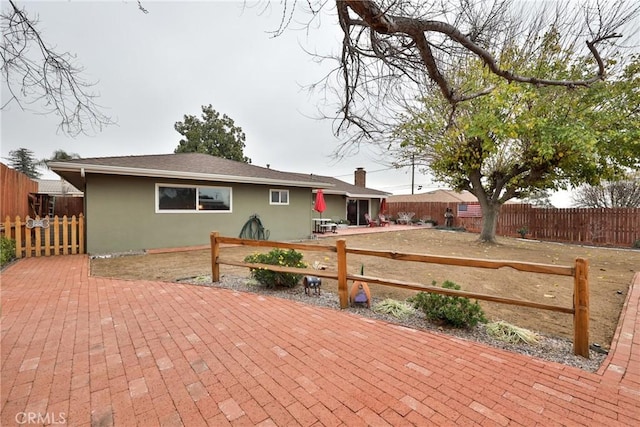 rear view of property with a patio area