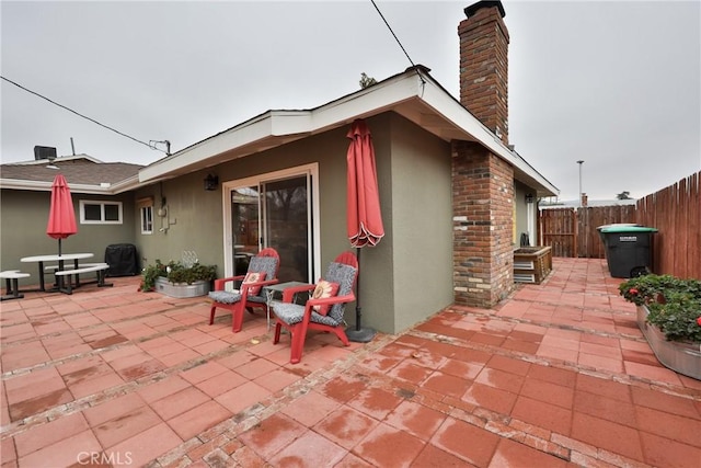 rear view of property with a patio area