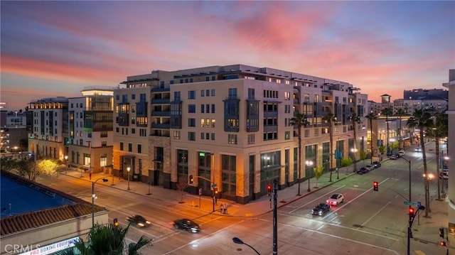 view of outdoor building at dusk